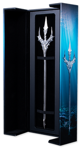 Decorative trident in a black stand with a blue underwater-themed background