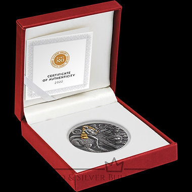 Silver coin with certificate of authenticity in a red box