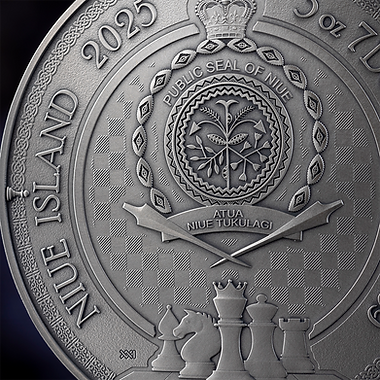 Close-up of a silver coin with detailed embossed design and text