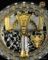 Close-up of a detailed emblem with gold and black design, featuring an eagle and shield, on a dark background.