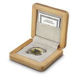 Coin in a wooden box with a certificate of authenticity on a white background