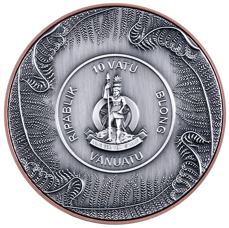 Silver coin with intricate designs and text, featuring a central emblem and surrounding patterns.