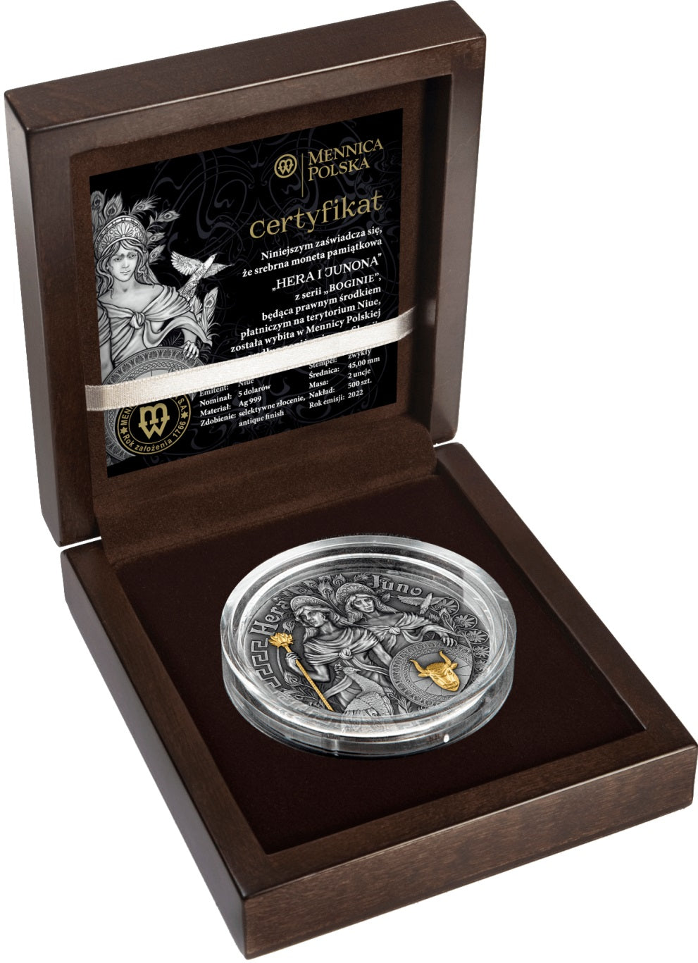 An open, premium matte-brown wooden display case showcasing the 2022 Niue Hera and Juno 2 oz silver coin. The coin rests in a protective capsule within a custom black velvet insert. Tucked into the inside lid of the upright box is the black and white Certificate of Authenticity featuring illustrations of the goddesses.