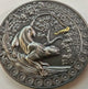A video of the Ghana 2022 Panther coin where anilmation brings the coin to life showing the golden bird flying off in a hurry losing some feathers as the Panther leaps of his branch in the tree and  after it.