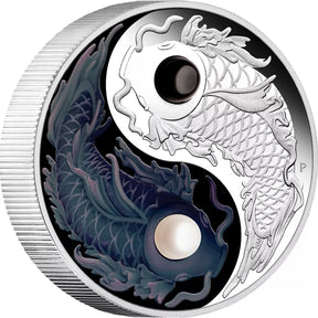 Silver coin with yin yang design featuring dragons on a white background