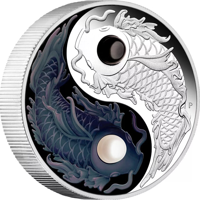 Silver coin with yin yang design featuring dragons on a white background