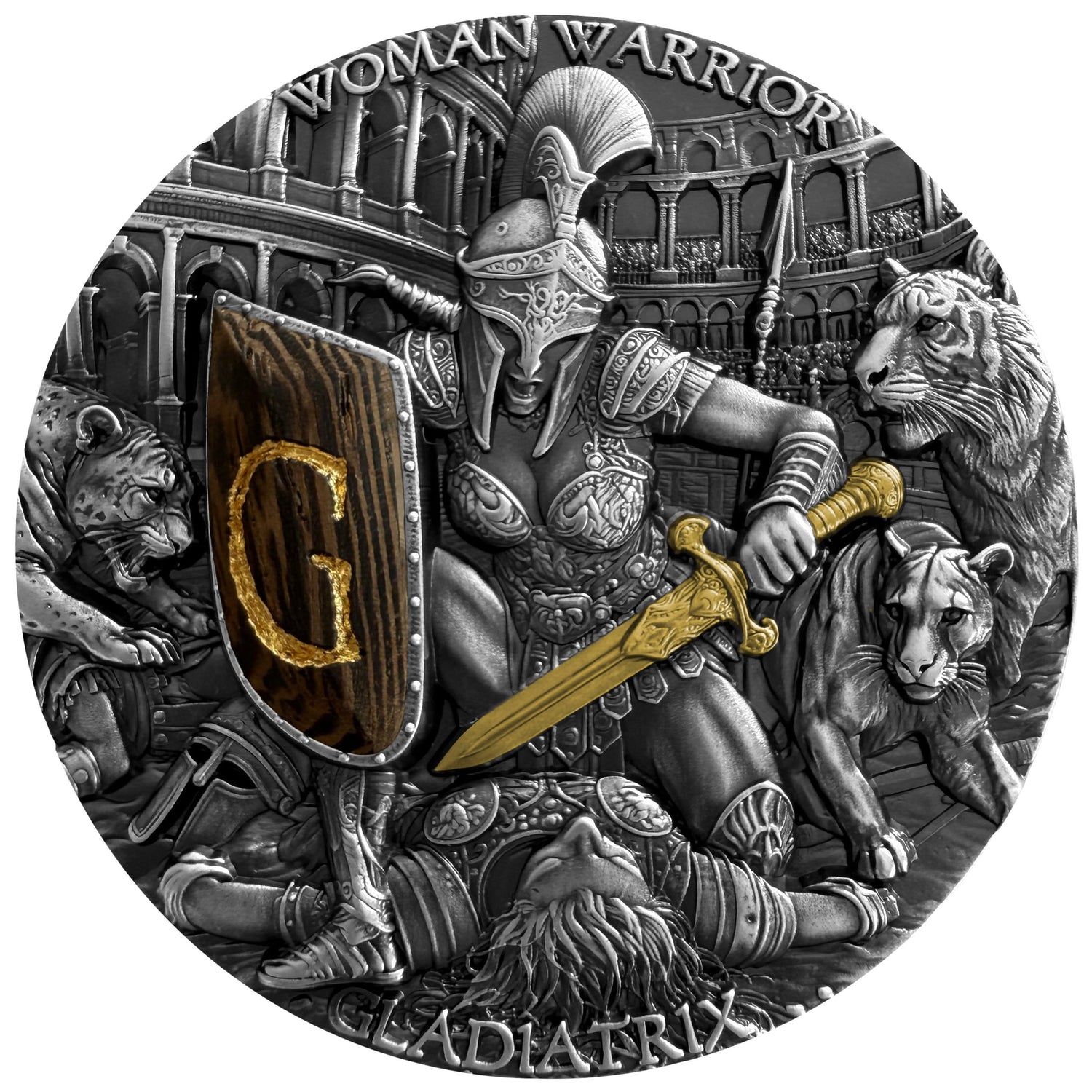 A circular silver-toned coin or medallion featuring a detailed gladiator scene with a warrior holding a sword and shield marked with a gold letter G, surrounded by animals and an arena background. The text 'WOMAN WARRIOR' and 'GLADIATRIX' is visible around the border.