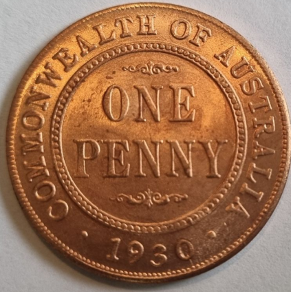 A replica of a 1930 Australian Penny with a shiny new untoned copper finish, showing the obverse and reverse sides.