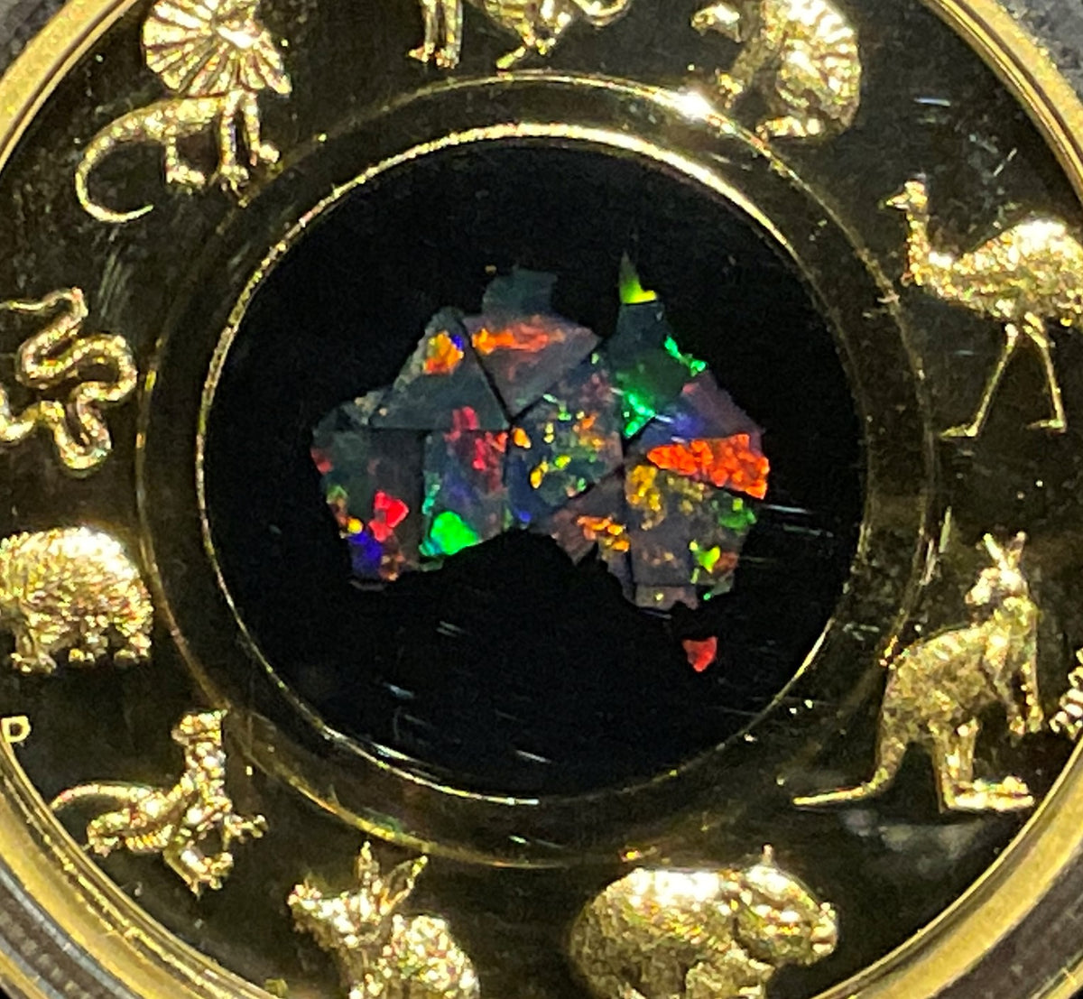 Australia 2022 $200 Great Southern Land 2oz Gold Proof Opal Coin. Detail of Gold Australian Animals and Opal Map.