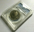 Angled reverse and label: 2000 Australian Millennium Incused Flag 50c coin in a PCGS AU53 holder, showing the flag reverse and certification label.