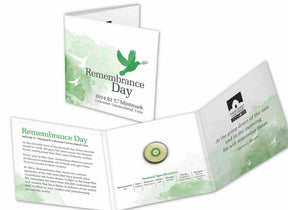Folder presentation: Closed and open 2014 $2 Remembrance Day C mintmark folder with mounted green-coloured coin.