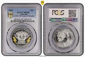 Front and back of PCGS holder: Australia 2018 AC/DC 45 Years of Thunder 50c coin graded MS68, with yellow lightning bolts and Queen Elizabeth II portrait.