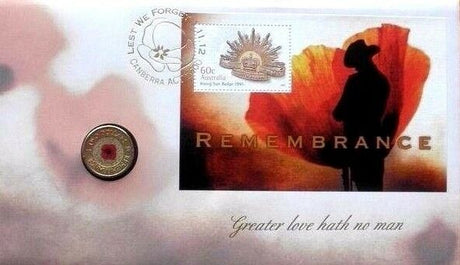 Cover front: Australia 2012 Remembrance stamp and coin cover with red poppy $2 coin, Rising Sun badge stamp, soldier silhouette and “Greater love hath no man” inscription.