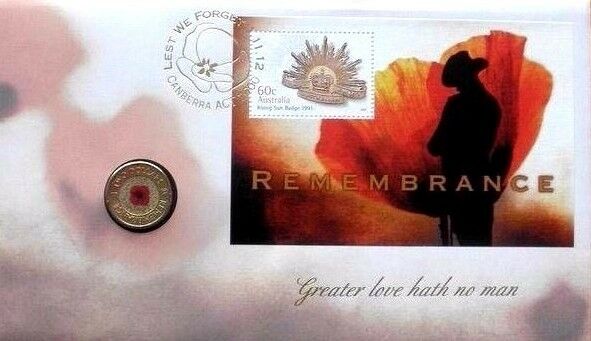 Cover front: Australia 2012 Remembrance stamp and coin cover with red poppy $2 coin, Rising Sun badge stamp, soldier silhouette and “Greater love hath no man” inscription.