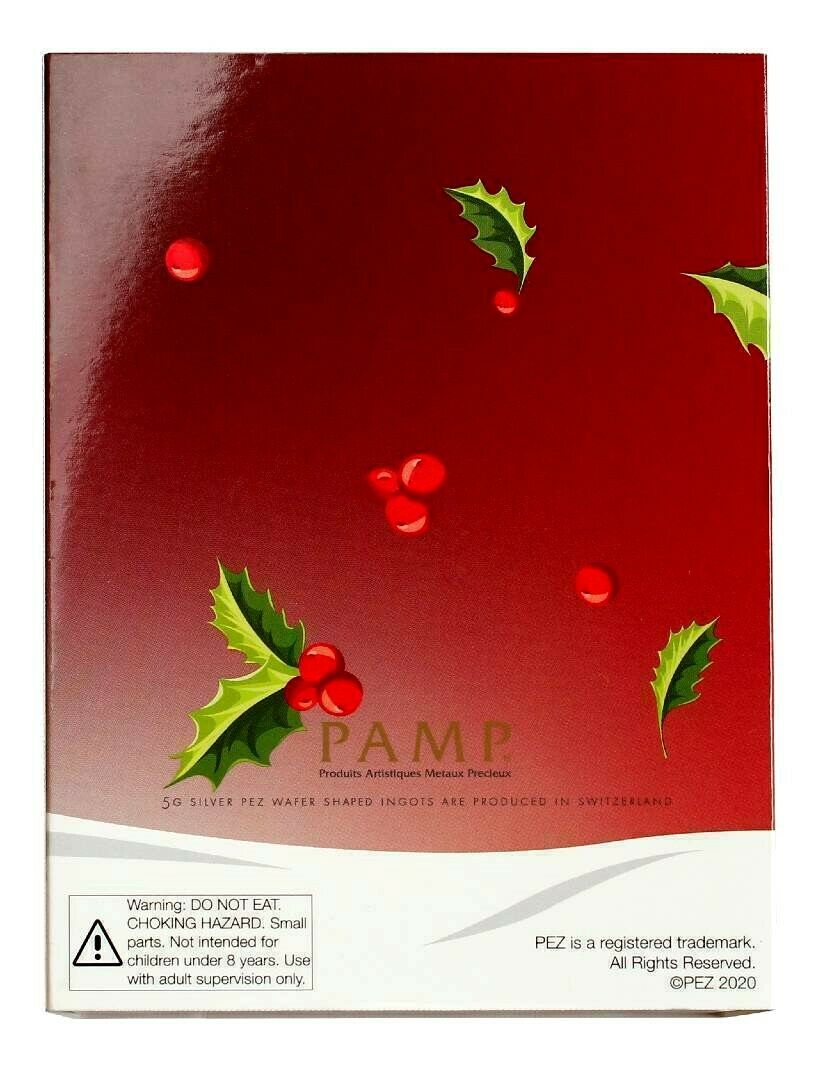 Box back: Red PAMP PEZ gift box with holly decoration, Swiss production statement and safety warning.