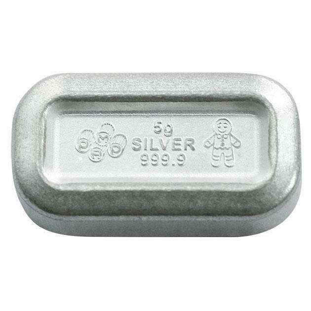 Wafer detail: PAMP 5 g silver wafer marked 999.9 with a Gingerbread Man motif.