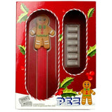Box front: PEZ Gingerbread Man gift set in red Christmas packaging with dispenser and six silver wafers.