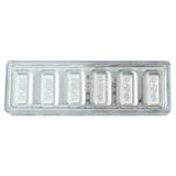 Wafer holder: Six PEZ silver wafers in a clear holder showing the logo and Gingerbread Man designs.
