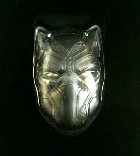 Fiji 2021 $2 Black Panther Mask 2oz Antiqued Silver Coin Perth Mint Capsule and Coin - A metallic black panther mask with intricate geometric engravings, displayed against a dark blue satin fabric background.