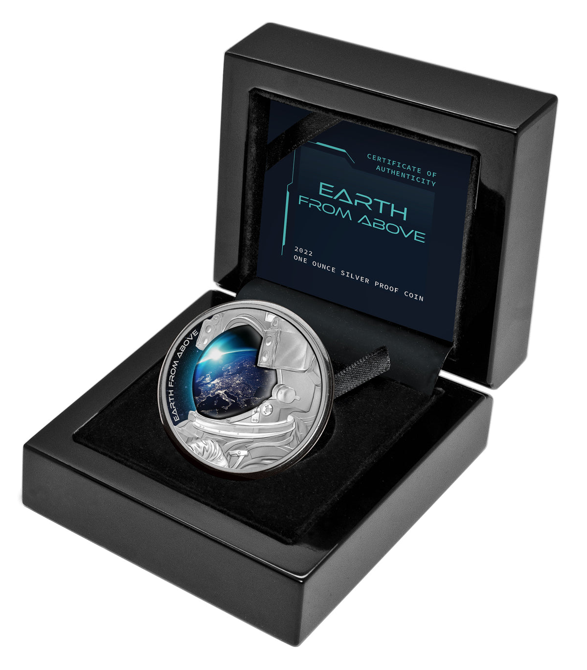 Niue 2022 Earth From Above silver proof coin showing Earth reflected in an astronaut’s visor sitting in it's open black laquer case. The Case is facing toward the left.