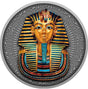 A close-up view of the detailed reverse side of the Niue 2022 2-ounce silver coin. The high-relief antiqued design centers on the legendary death mask of Pharaoh Tutankhamun, intricately embellished with selective yellow-gold gilding and deep blue accents on the nemes headdress. The top features the protective uraeus cobra and vulture symbols, while a traditional artificial beard accents the chin. The entire mask is framed by an etched border of historic Egyptian hieroglyphics.