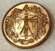 A nickel olored coin featuring an engraved design that represents Da Vinci's Last Supper.