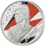 United Kingdom 2020 £2 David Bowie .999 Silver Proof Coin Reverse. The reverse design showcases a striking portrait of David Bowie against a backdrop of a lightning bolt—a symbol synonymous with his chameleonic career and boundary-pushing artistry. This special edition boasts a meticulous Proof finish, highlighting the contrast between the frosted details and mirror-like fields, enhanced by vibrant colour applications that bring the design to life.